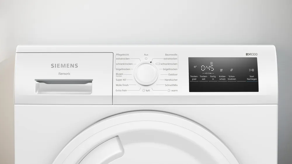 Nahaufnahme des Bedienfelds des Siemens WT43HV03 Trockners mit Programmauswahl und Digital-Display