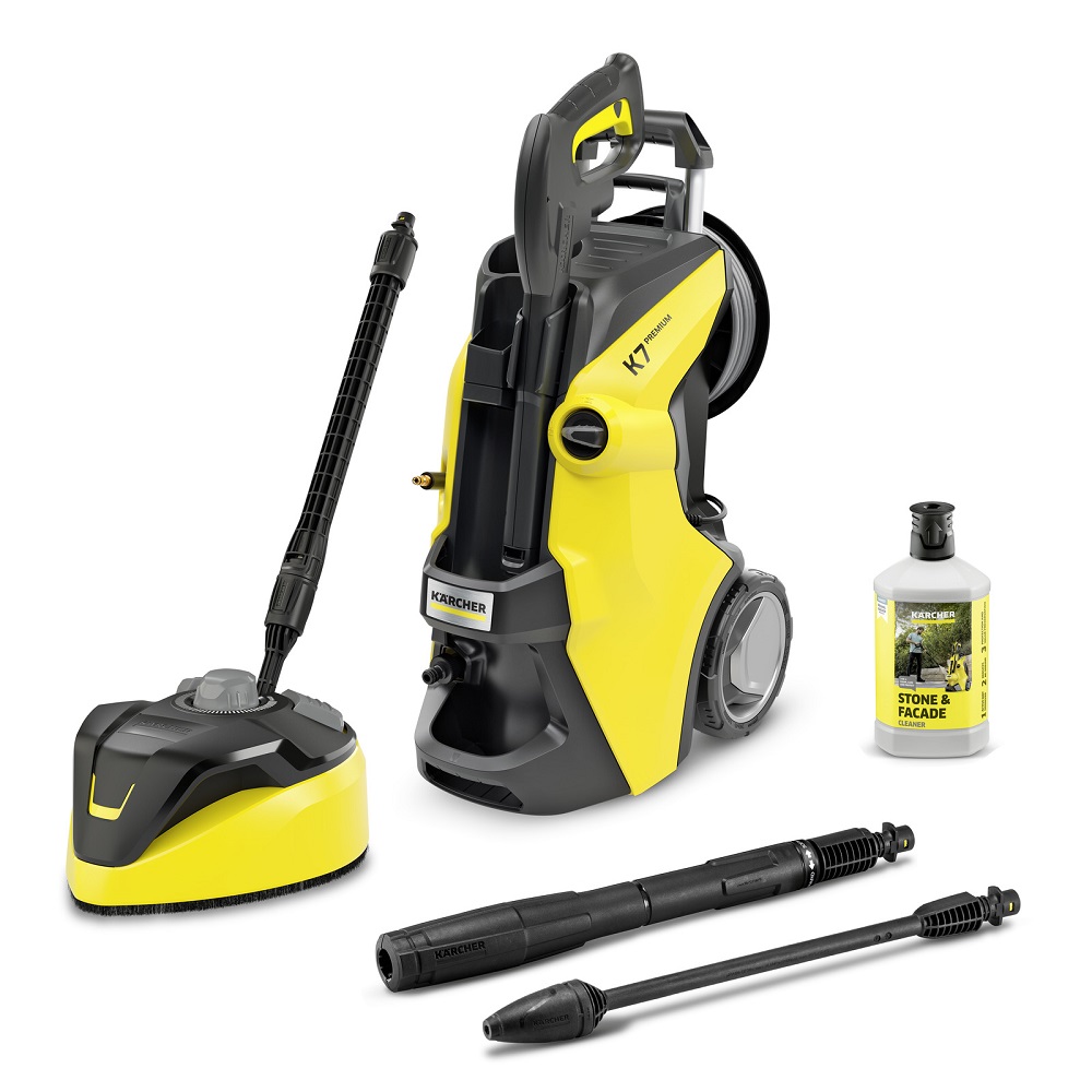 Gesamtansicht des Kärcher K7 Premium Hochdruckreinigers (gelb/schwarz) mit Flächenreiniger T-Racer, Vario Power Jet, Dreckfräser und Steinreiniger-Flasche.
