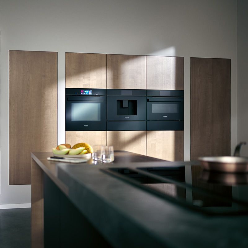 Front view of Siemens BE555LMB1 built-in microwave in black and stainless steel
