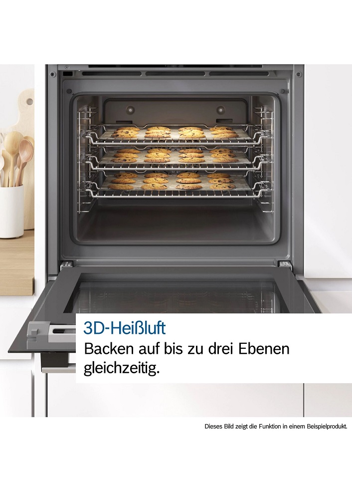 Opened oven with freshly baked cookies on three racks demonstrating the 3D Hotair feature.