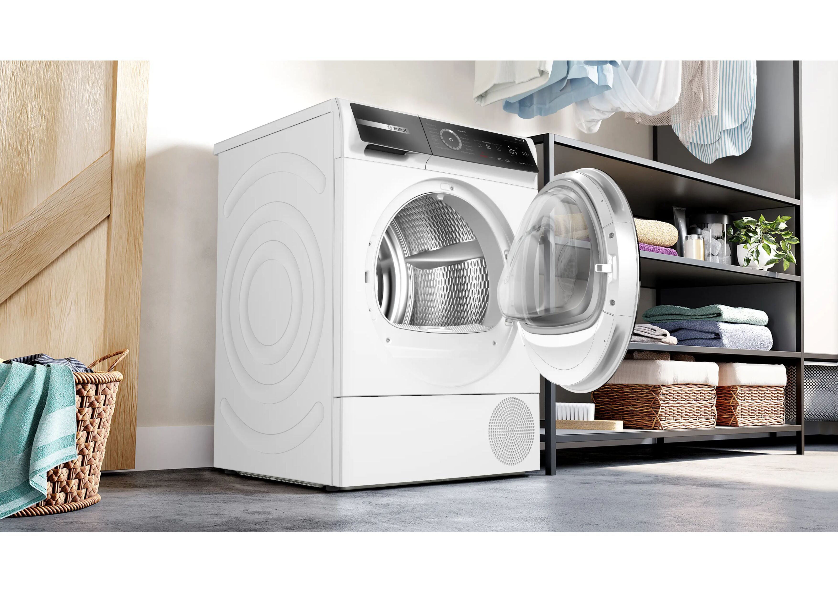 Bosch Wärmepumpentrockner mit offener Tür in einer modern eingerichteten Waschküche.