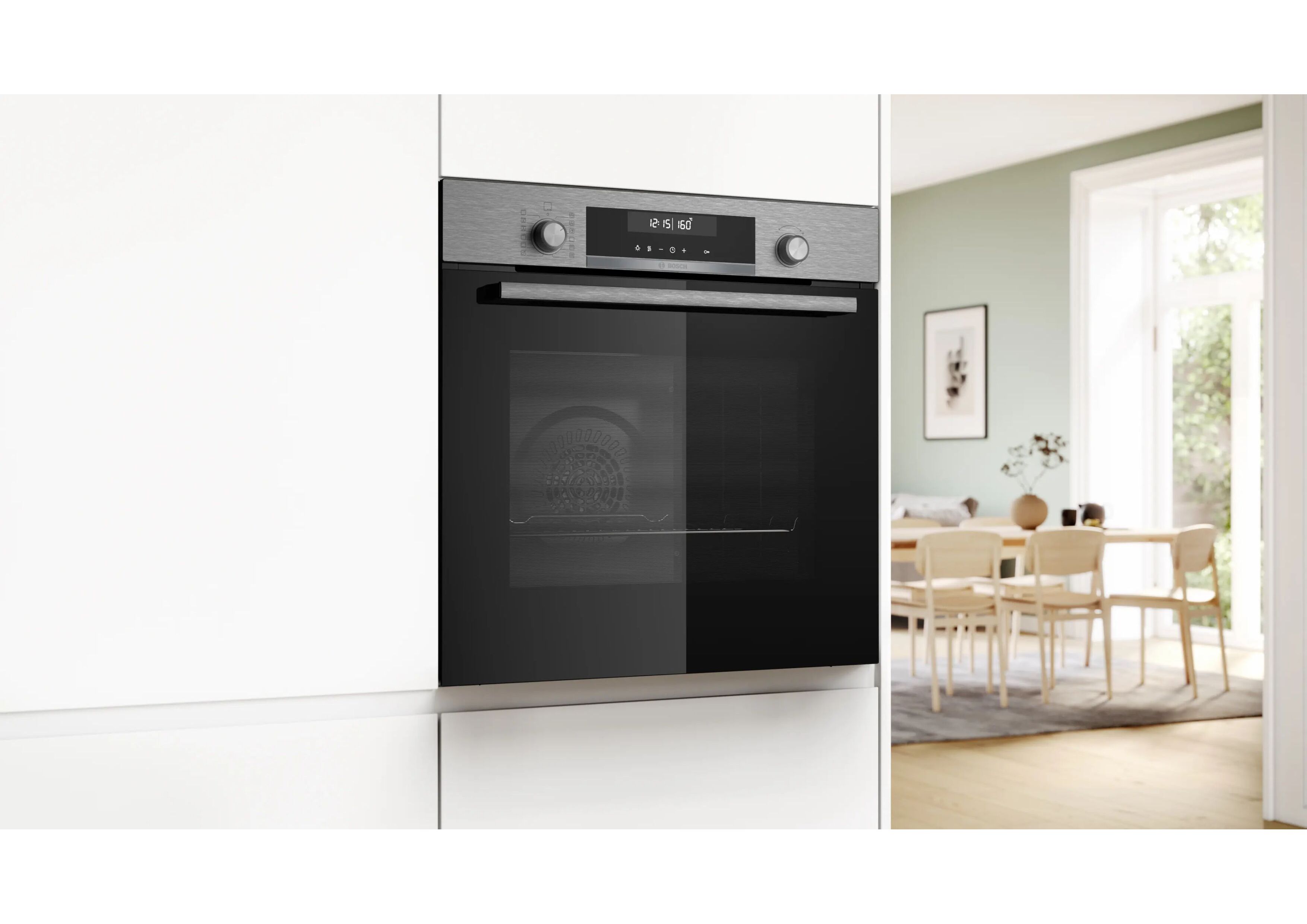 Perspective view of the closed oven integrated into a white kitchen unit