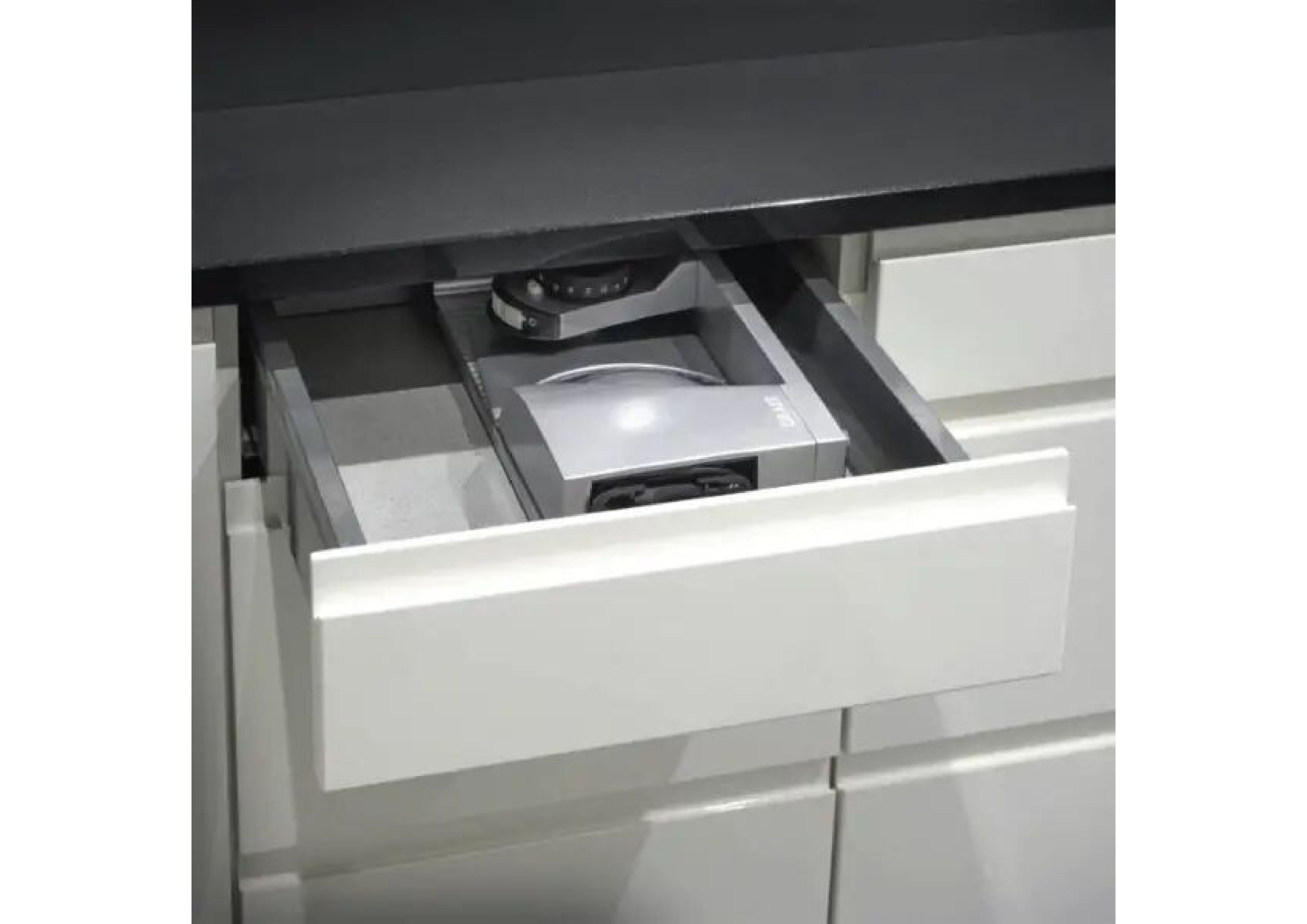 Folded Graef food slicer stored space-savingly in a white kitchen drawer