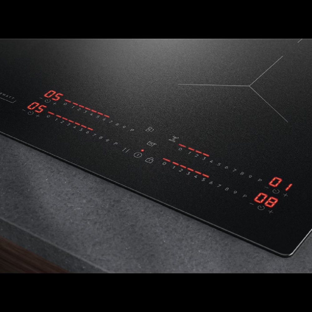 Perspective view of the illuminated controls built into a dark stone countertop