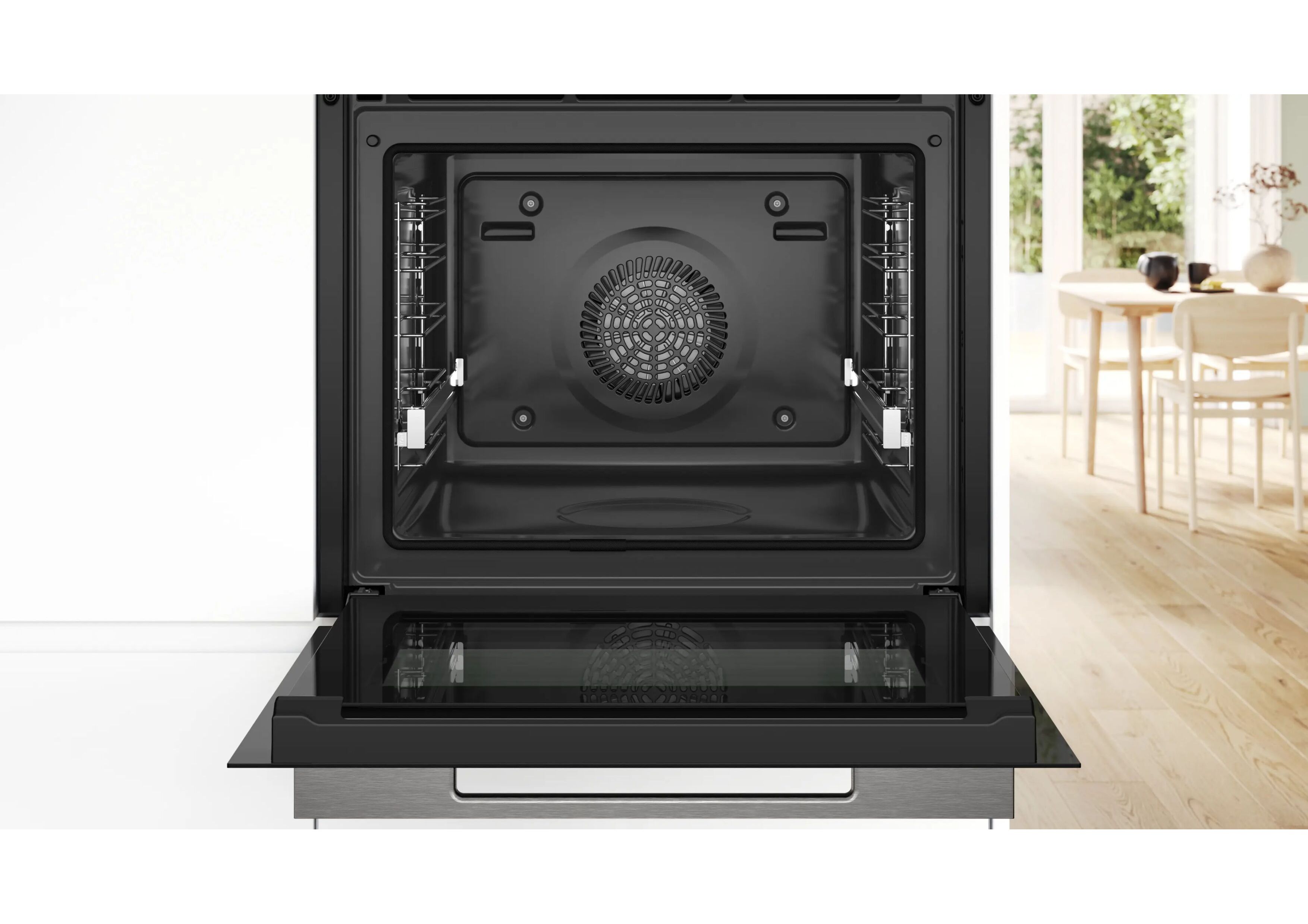 Frontal view into the black cavity of the open Series 8 oven