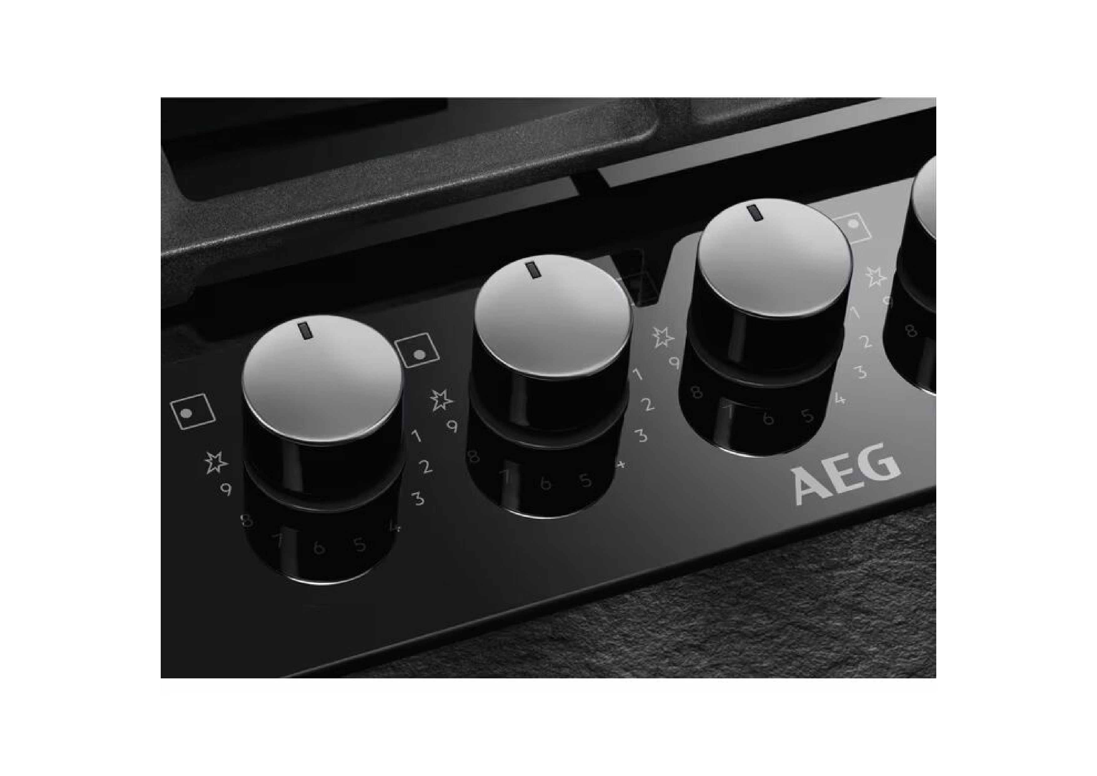 Close-up of StepPower control knobs with numerical scale from 1 to 9 on black glass