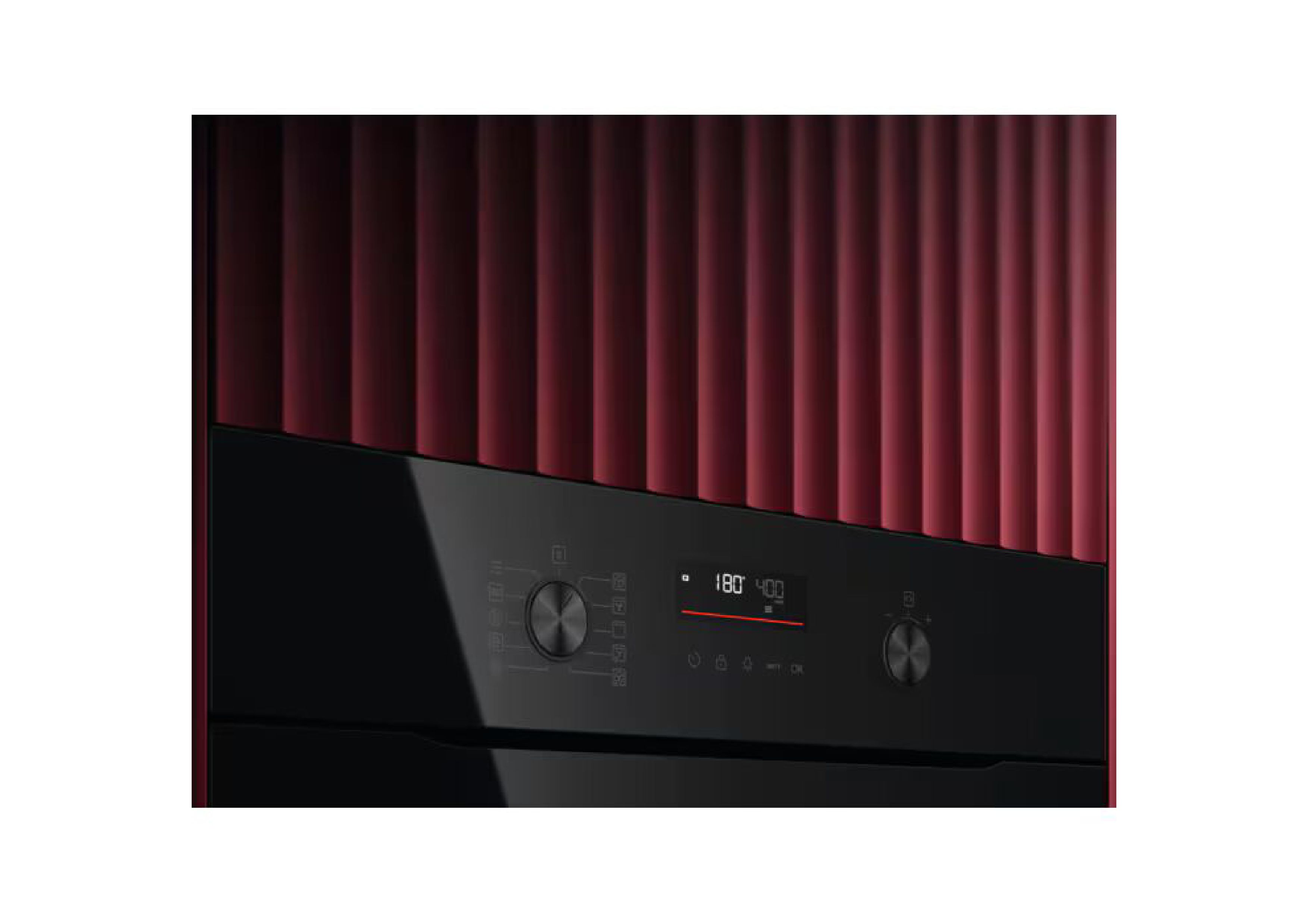 Oblique view of the illuminated control panel in front of a red paneled wall.