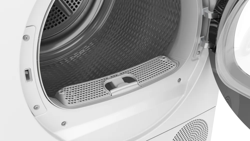 Flusenfilter im unteren Bereich der Trommel Nahaufnahme des unteren Flusenfilters (Sieb) im geöffneten Bullauge des Trockners, der vor der Reinigung entfernt werden kann.