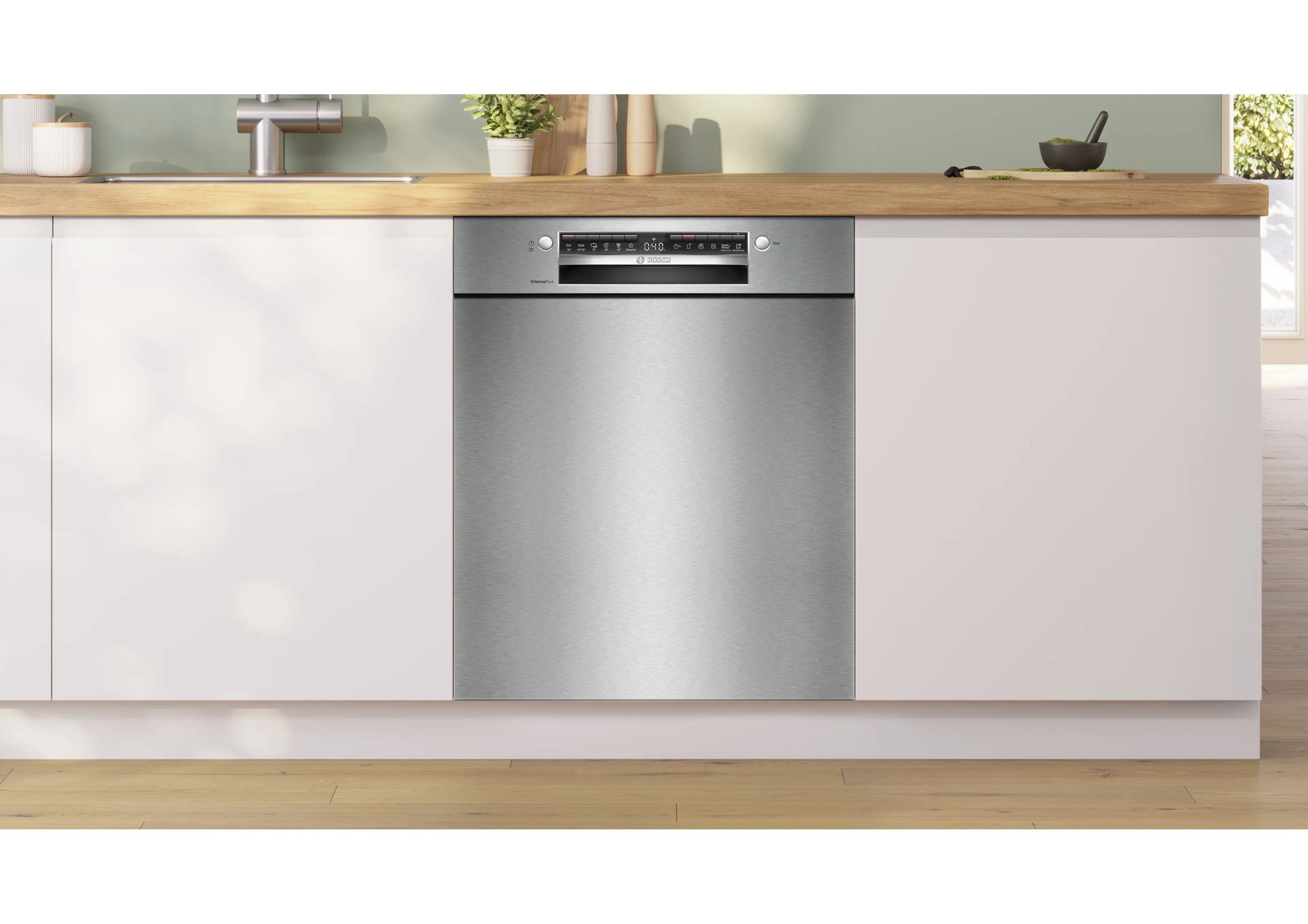 Bosch SMU4EVS08E stainless steel dishwasher perfectly integrated into a white kitchen unit