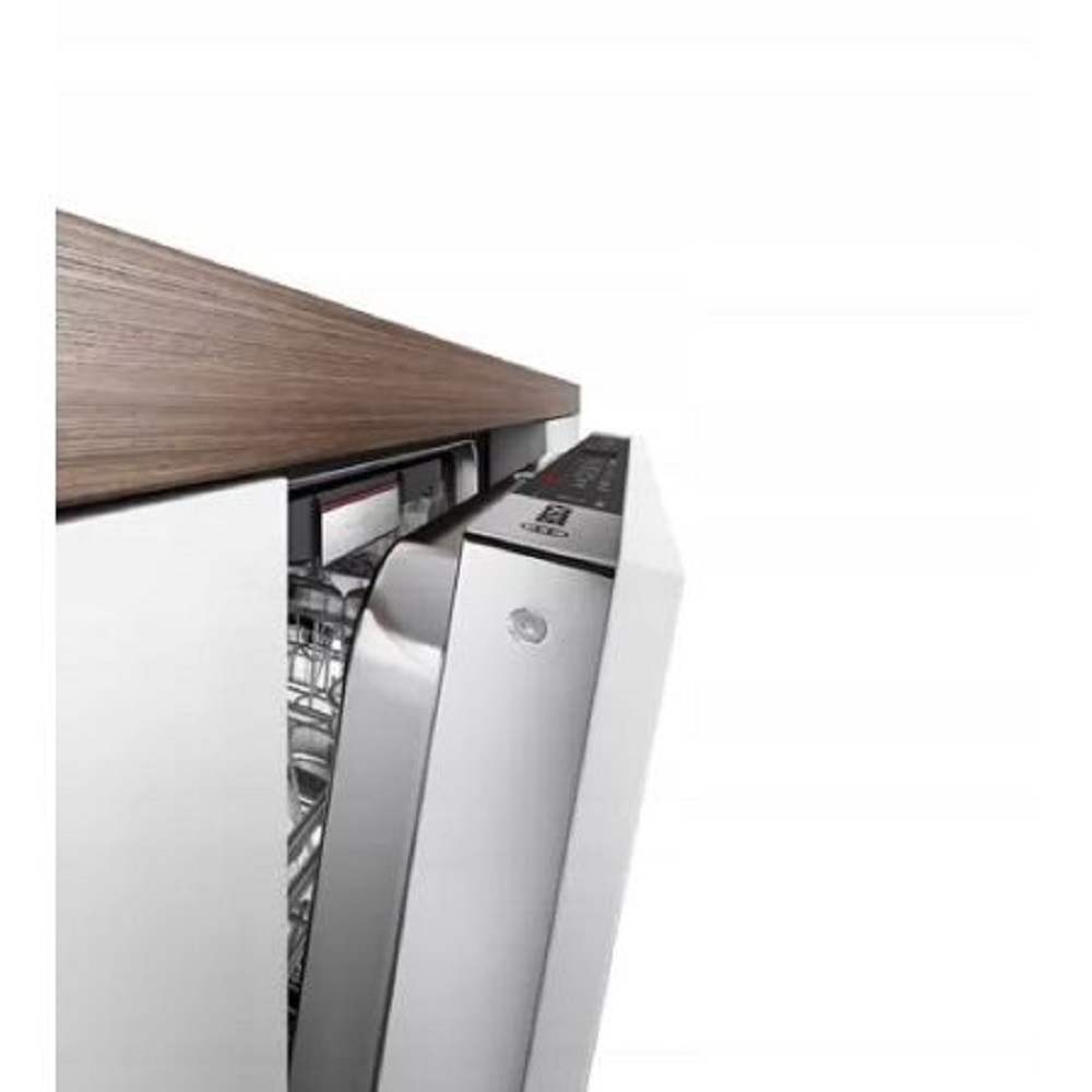 Side view of the open appliance door under a wood-look countertop showing the flush fit.