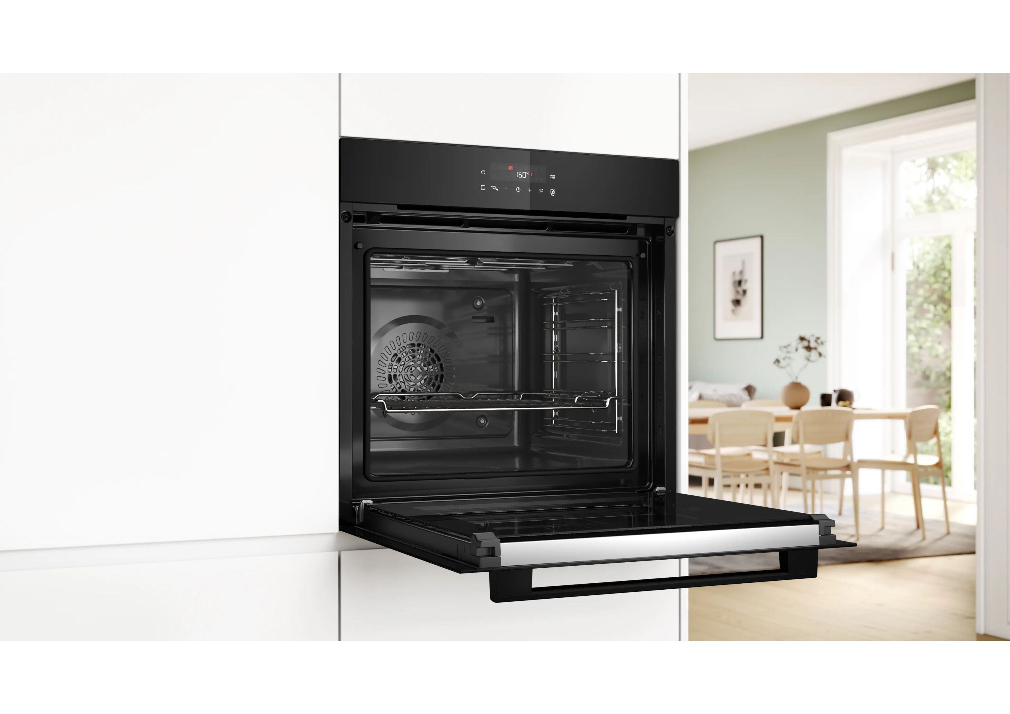 Bosch oven built into a white kitchen cabinet with the door wide open