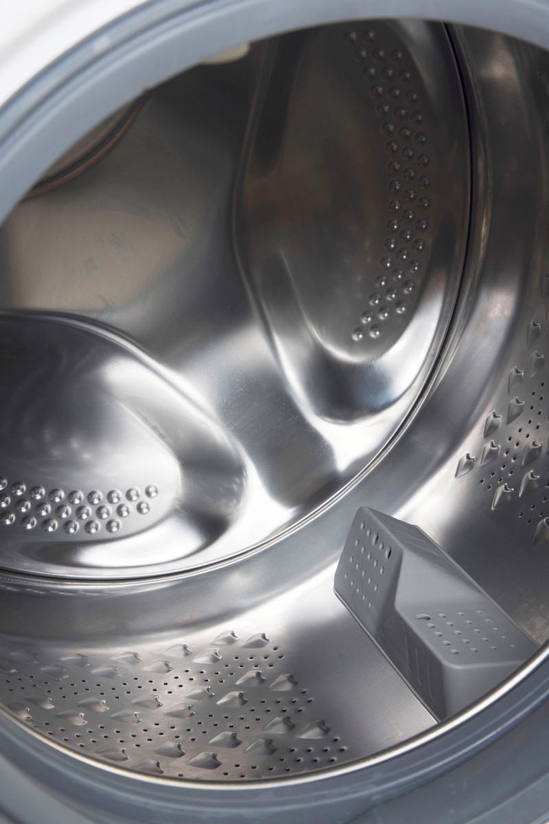 Open drum of the Beko washing machine showing the interior of the 10 kg stainless steel drum.