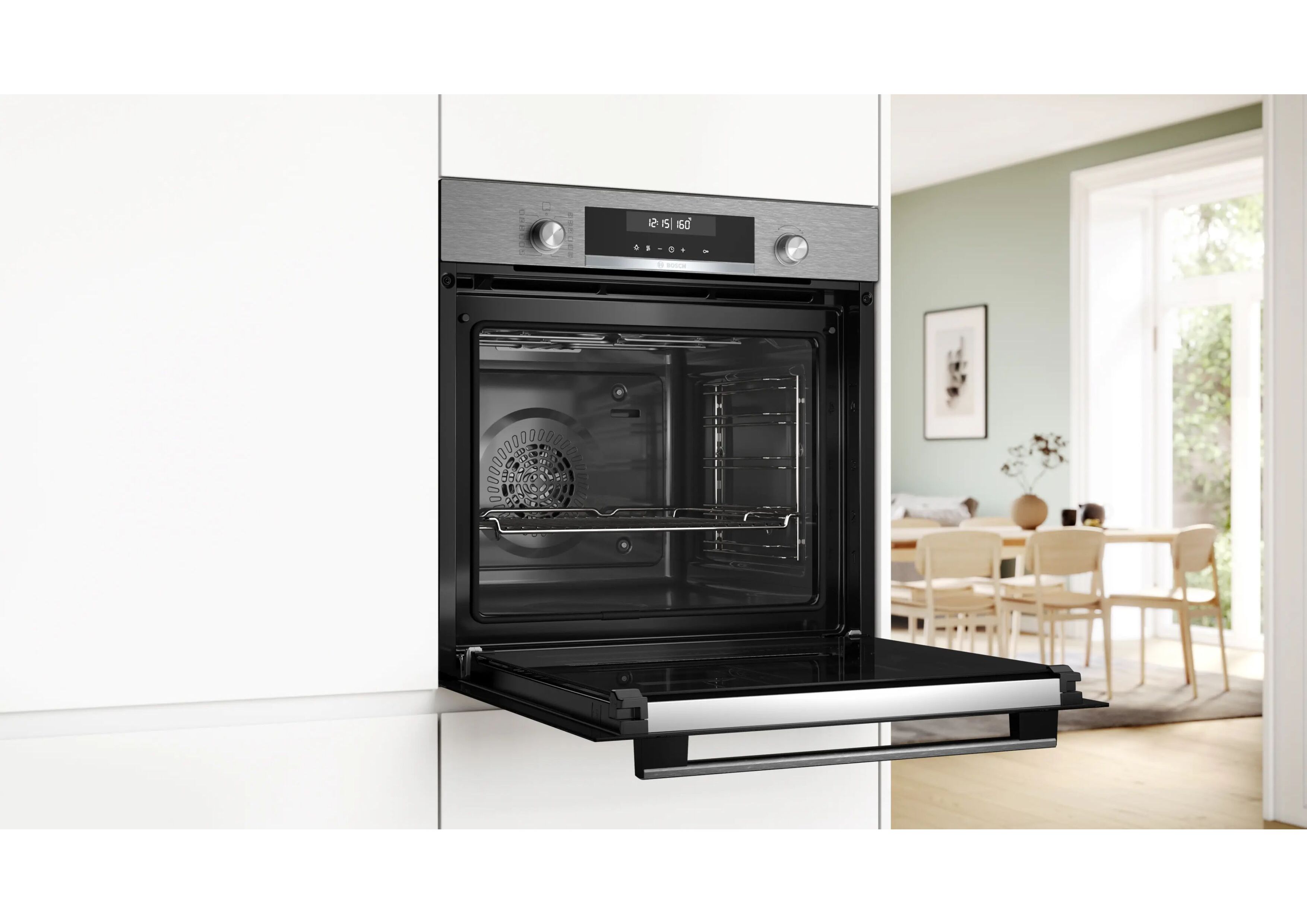 Side view of the open built-in oven in a bright modern kitchen