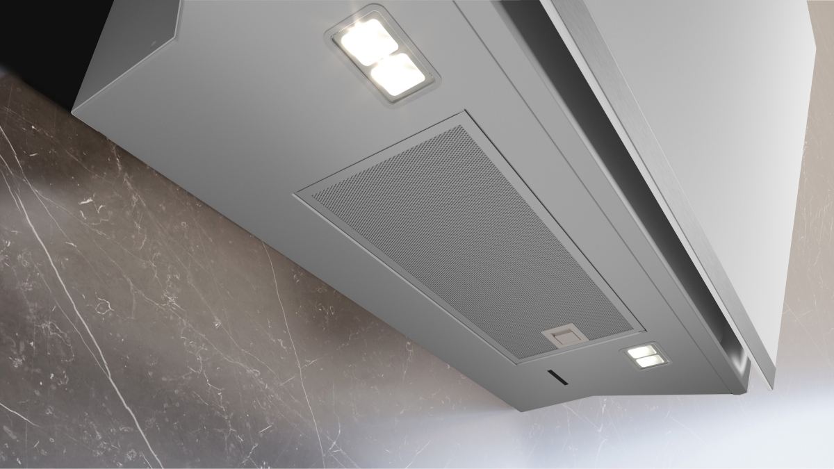 Ansicht von unten auf die Metallfettfilter und die beiden energiesparenden LED-Module der weißen Dunstabzugshaube.