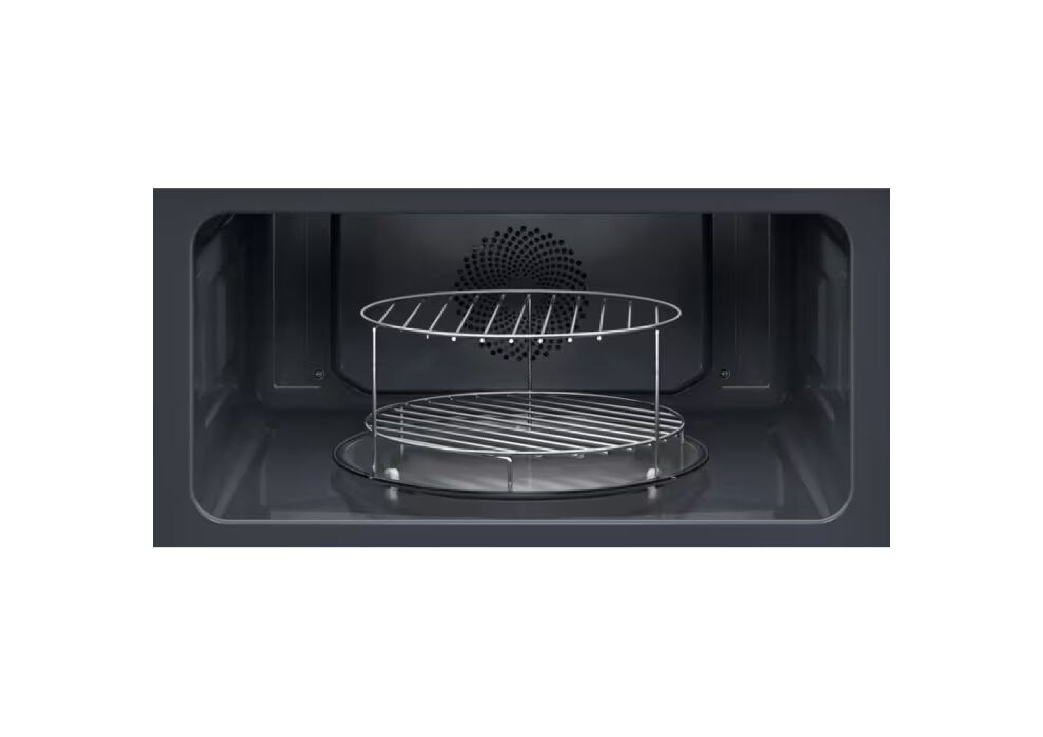 Interior of the compact oven with a round grill rack on the glass plate.