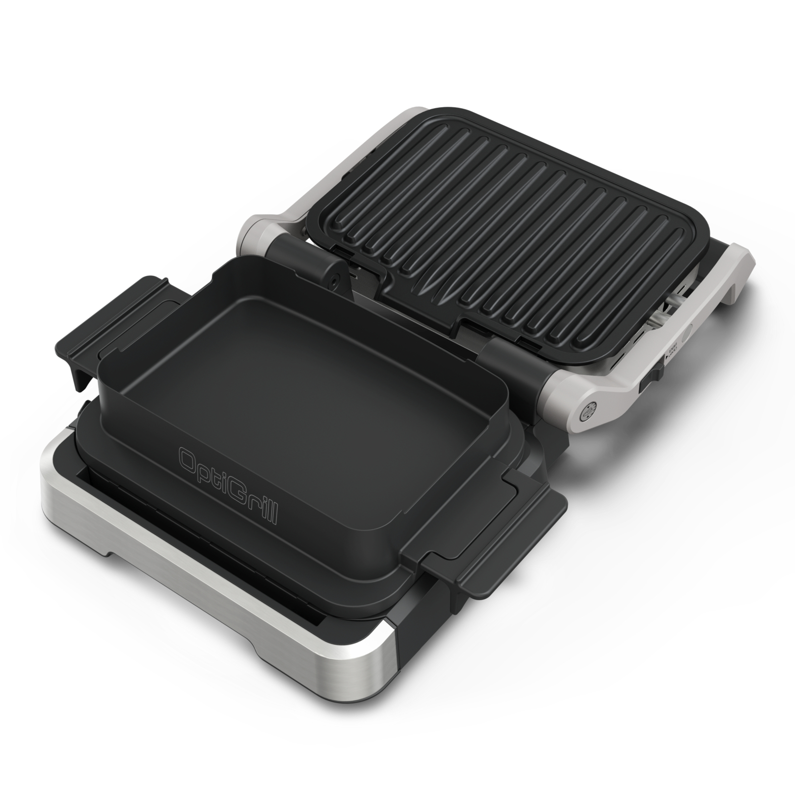 Opened barbecue grill with a baking tray on the left and a grill plate on the right