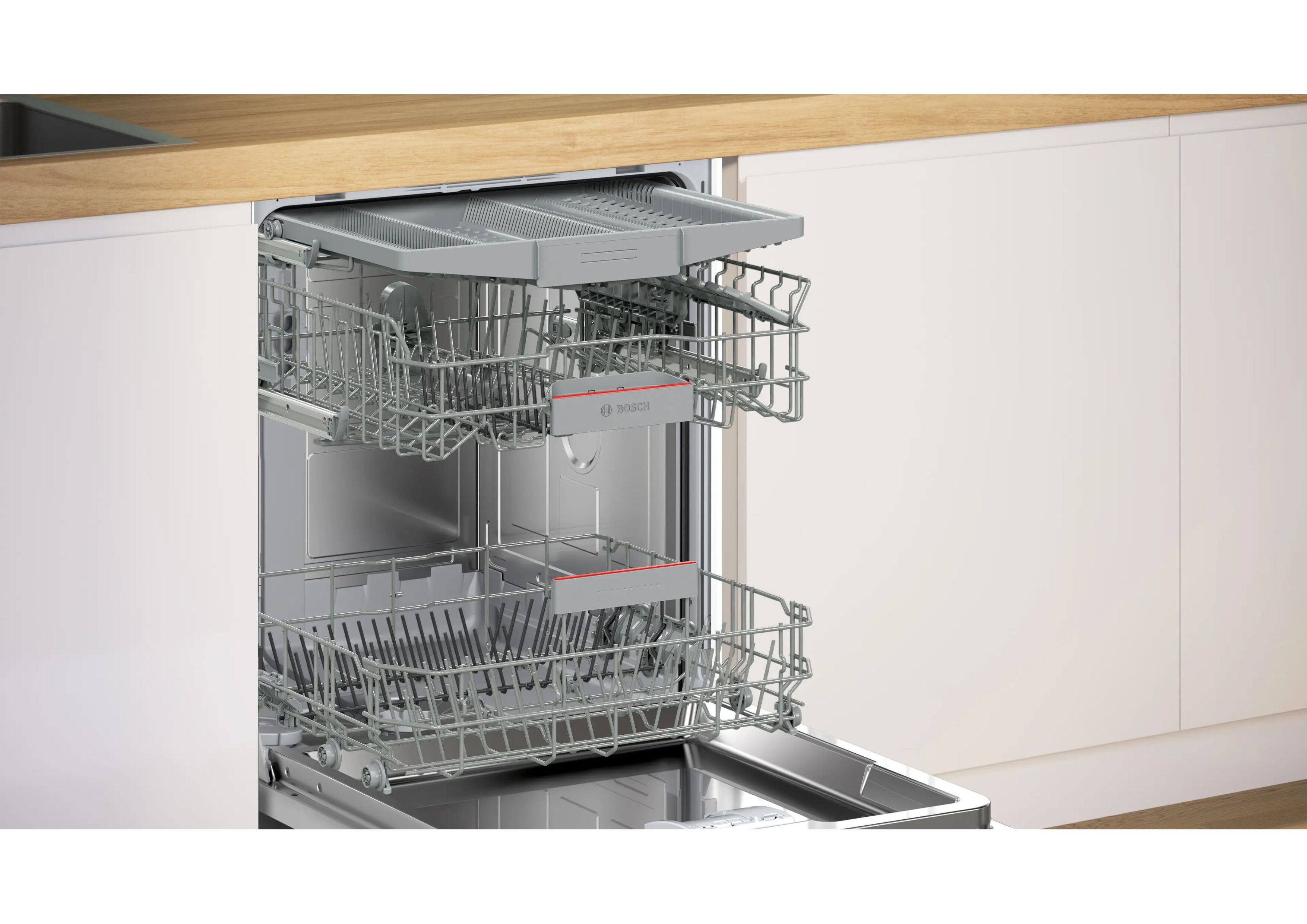 Interior view of the Bosch SMU4EVS08E with three levels including a pull-out cutlery drawer at the top