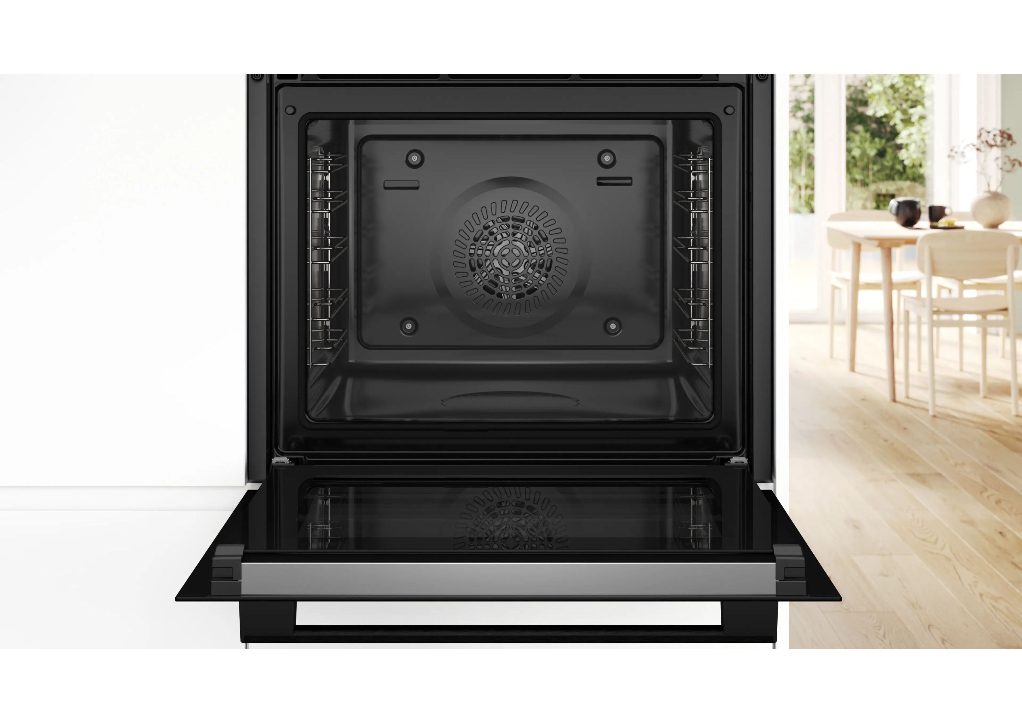 View into the empty cooking compartment of the Bosch Serie 2 oven with visible fan