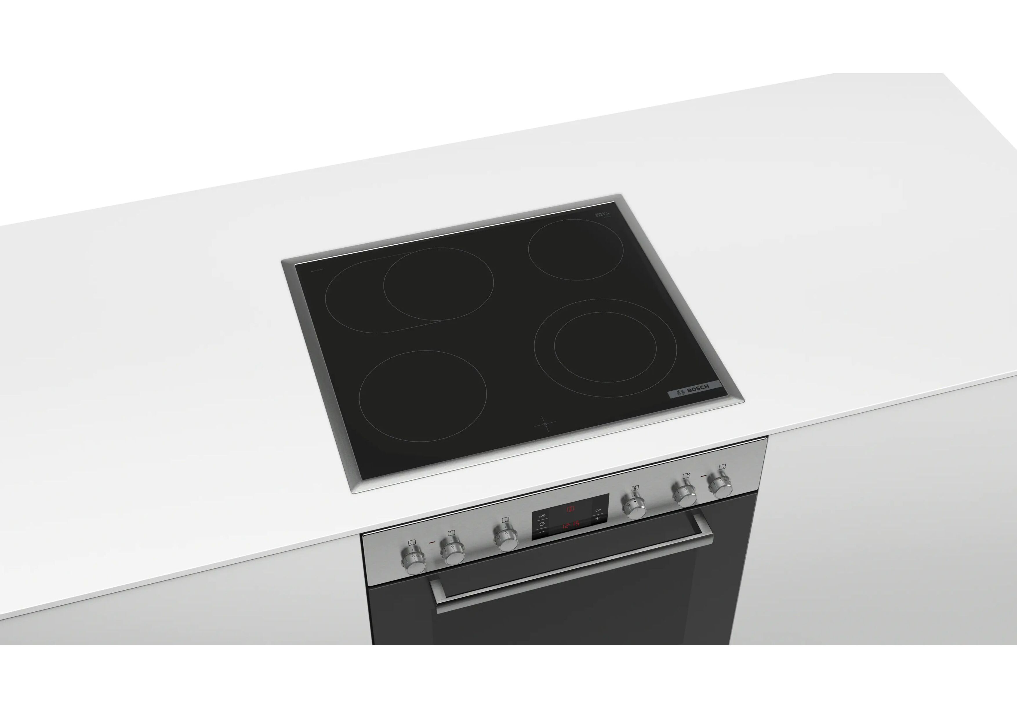 Bosch Elektrokochfeld eingebaut über einem passenden Backofen in einer weißen Küchenzeile.