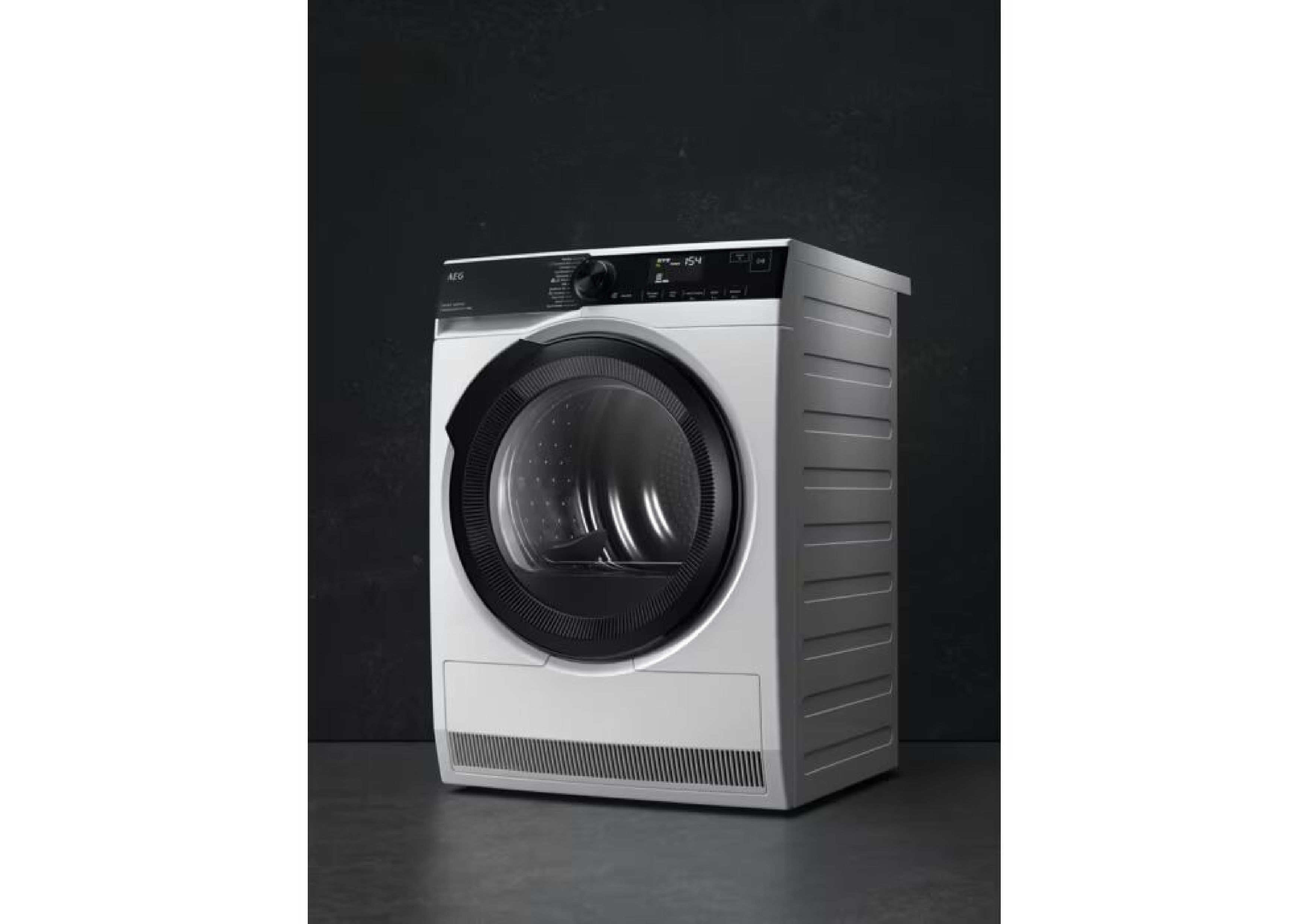 Free-standing white AEG tumble dryer in an angled side view against a dark background.