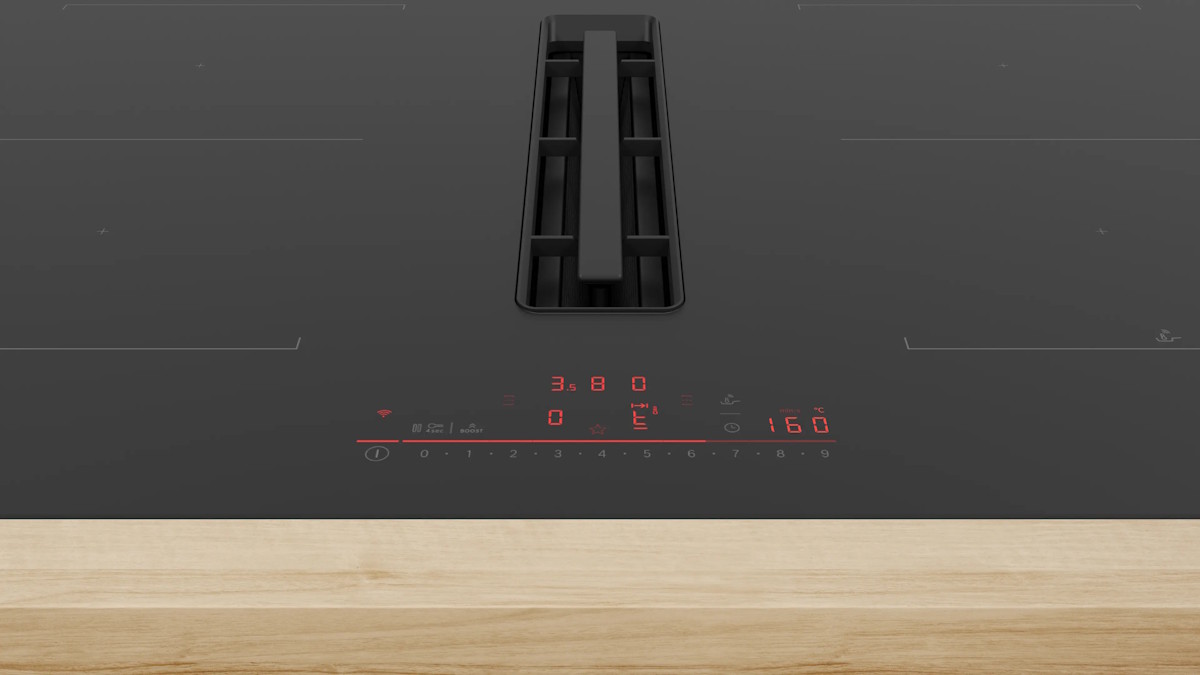 Close-up of CombiZone and PerfectFry Plus sensors on the black glass surface.