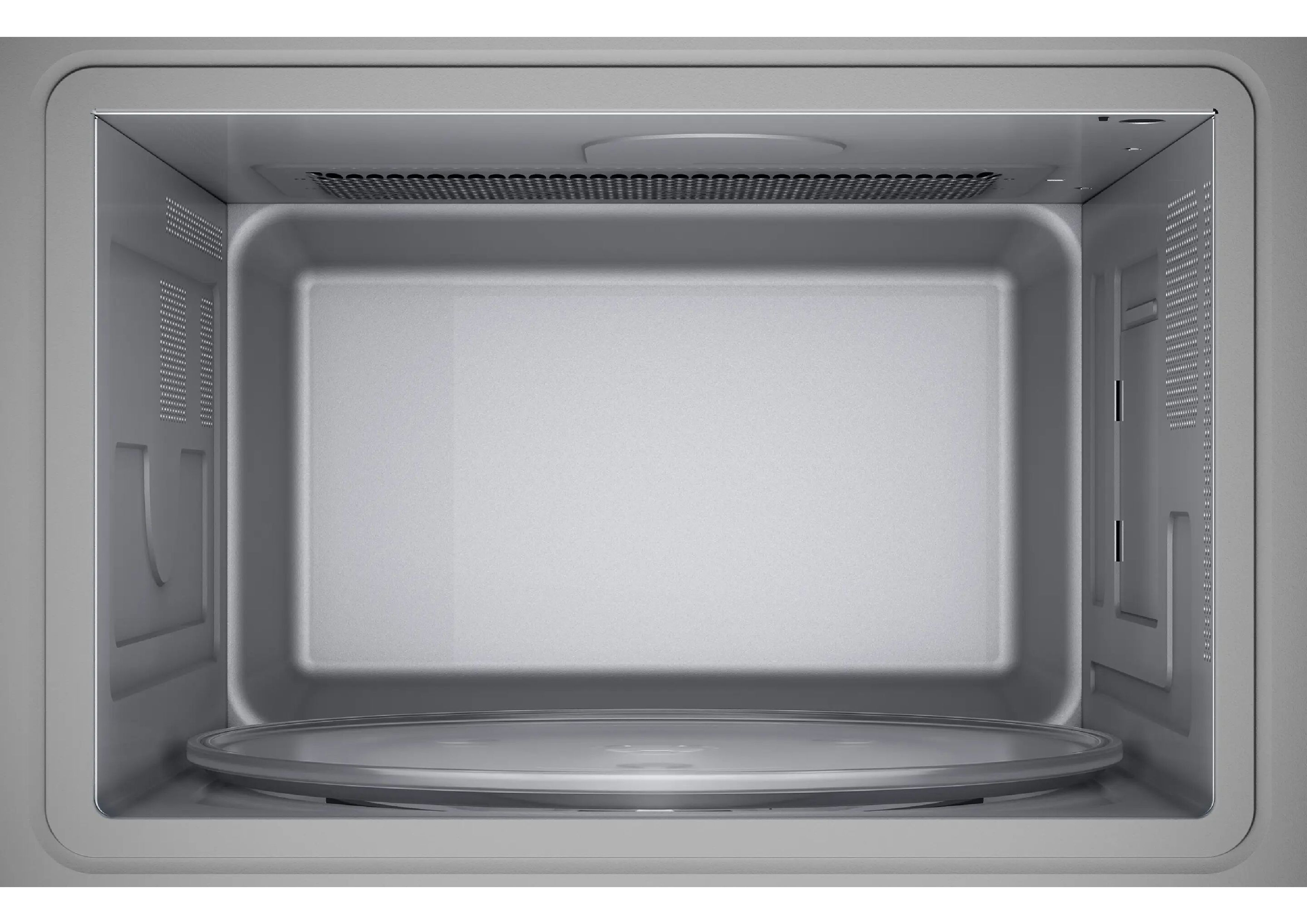 Empty stainless steel interior of a Siemens microwave with glass turntable.