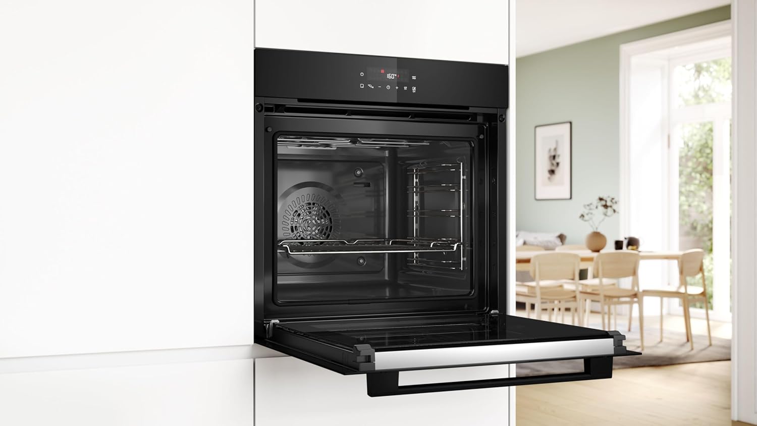 Perspective view of the open Bosch oven in a bright, modernly furnished kitchen.