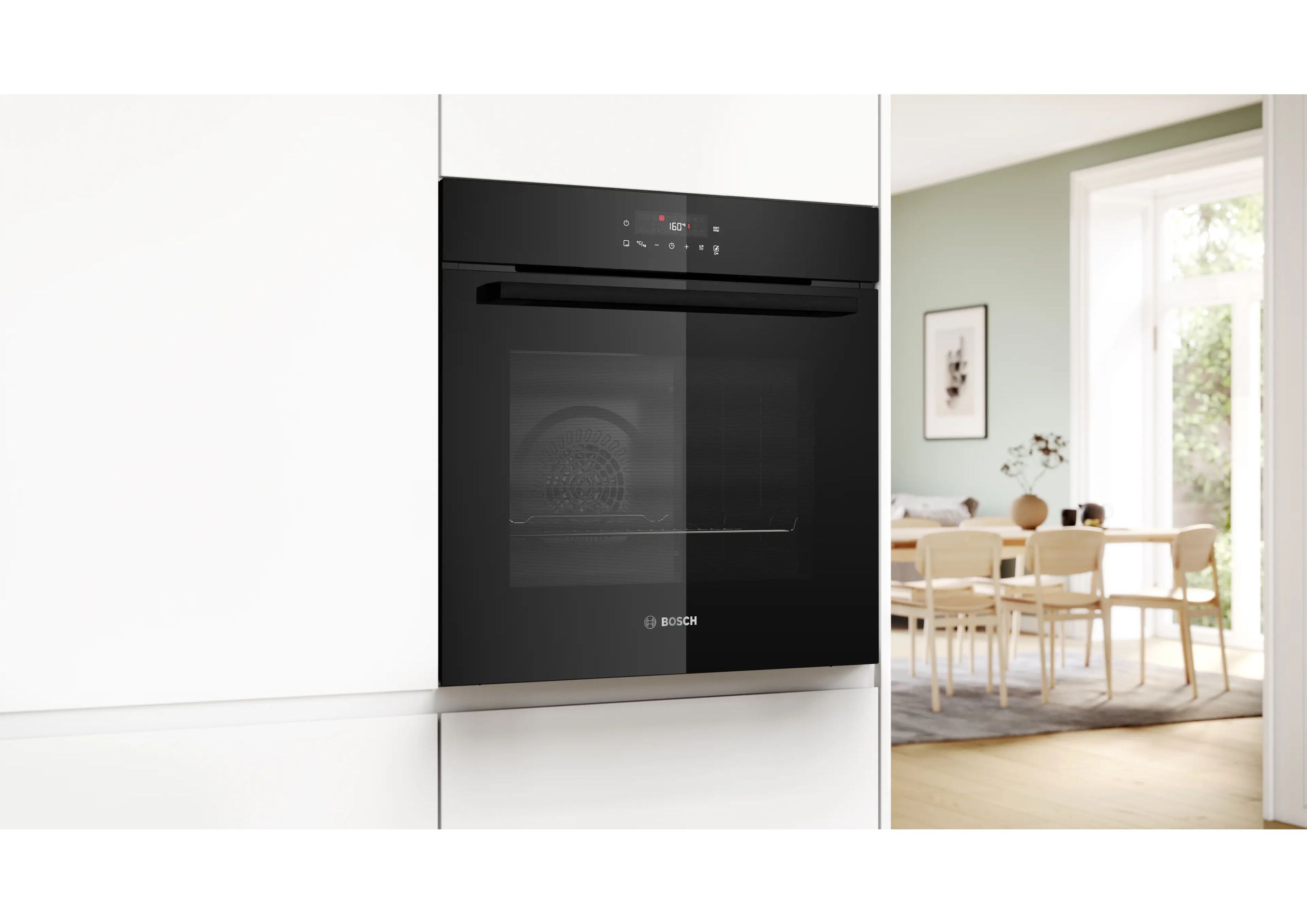 Closed black Bosch Serie 2 built-in oven in a modern white kitchen