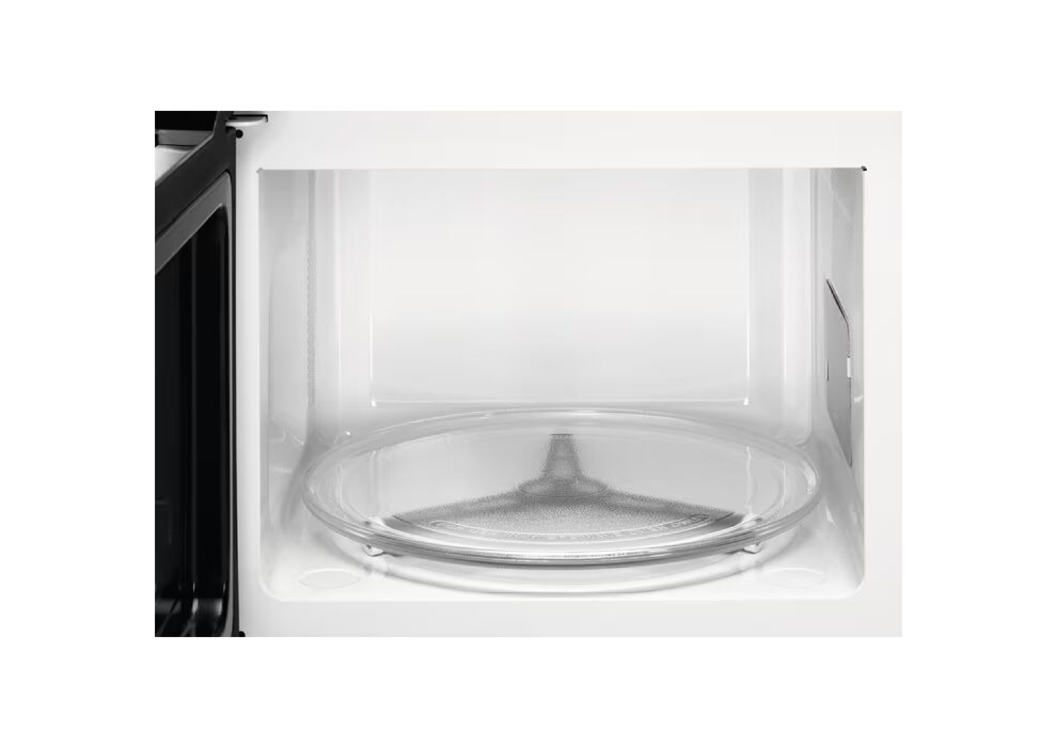 View into the white interior of the microwave with a glass turntable